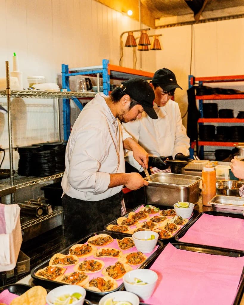 Chefs plating tacos for Superchido office and event catering