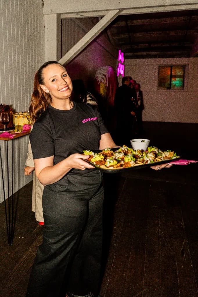Superchido server with a tray of tacos for home or venue catering