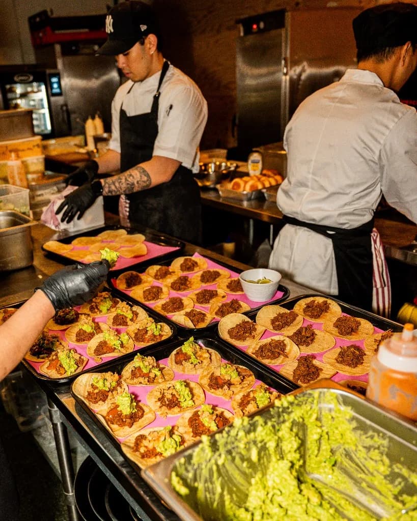 High-volume taco assembly with fresh guacamole for Superchido catering